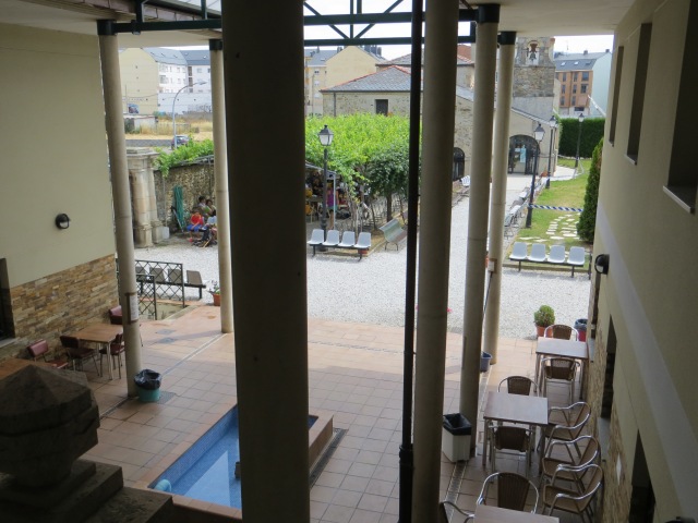 This is a view from upstairs looking out...so you can see the covered patio - complete with a fountain - the outside patio covered by trees, and also the chapel.